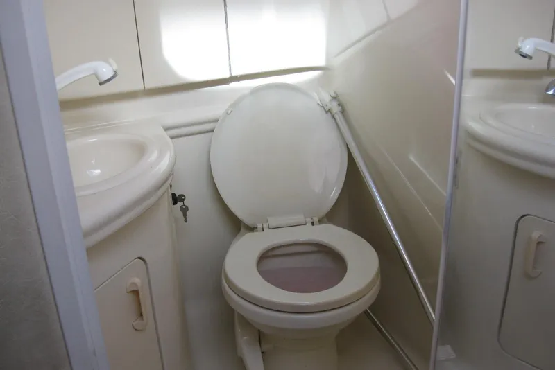 Slide: The Image of Interior of 2002 Sea Ray Sundancer 280 yacht, featuring seating and a table. - 38