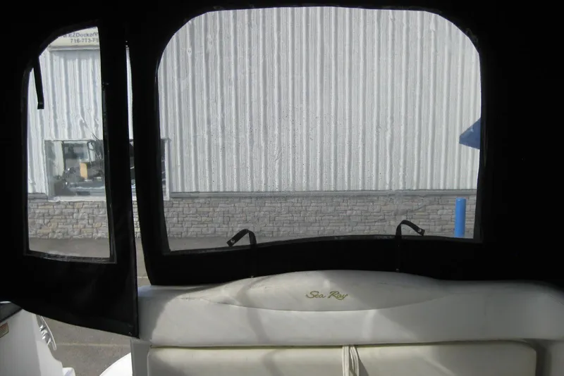 Slide: The Image of Engine compartment of a 2002 Sea Ray Sundancer 280 boat, showing hoses and components. - 43