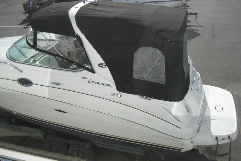 Slide: The Image of 2002 Sea Ray Sundancer 280 boat deck with logo and hatch detail. - 45