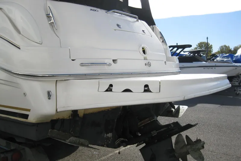 Slide: The Image of 2002 Sea Ray Sundancer 280 boat, rear view, docked at a marina. - 9