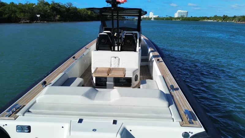 Slide: The Image of Technohull 47 Omega 2023 on calm waters with modern design. - 8