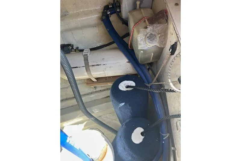 Slide: The Image of Interior of 1982 Ericson 33 sailboat showing ropes, cables, and equipment. - 14