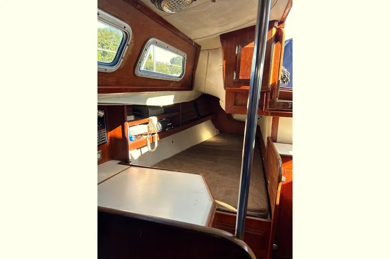 Slide: The Image of Interior of a 1982 Ericson 33 sailboat with wooden furnishings. - 16