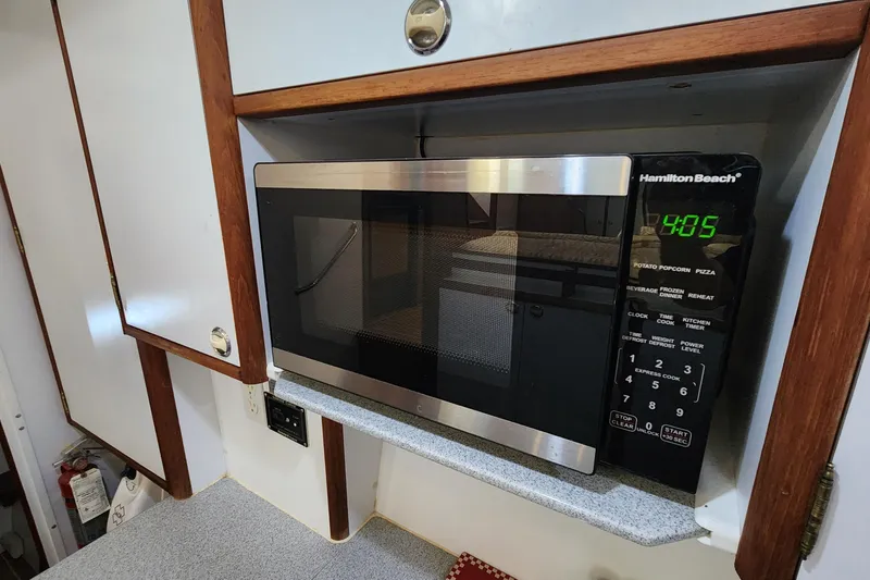 Slide: The Image of Microwave in 2005 Endeavour 44 TrawlerCat kitchen, featuring Hamilton Beach design. - 10