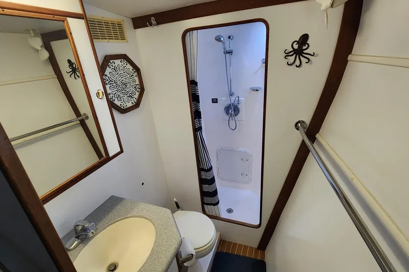 Slide: The Image of Bathroom interior of 2005 Endeavour 44 TrawlerCat with shower and nautical decor. - 12