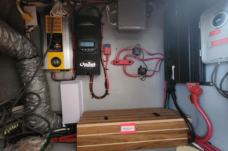 Slide: The Image of Electrical system setup in a 2005 Endeavour 44 TrawlerCat boat, featuring OutBack Power components. - 17
