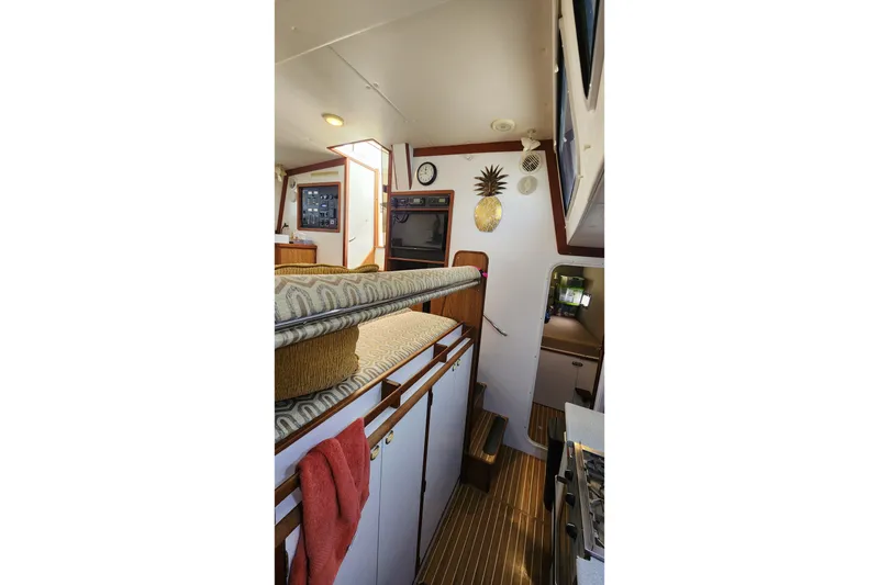 Slide: The Image of Interior of 2005 Endeavour 44 TrawlerCat with cozy seating and nautical decor. - 18