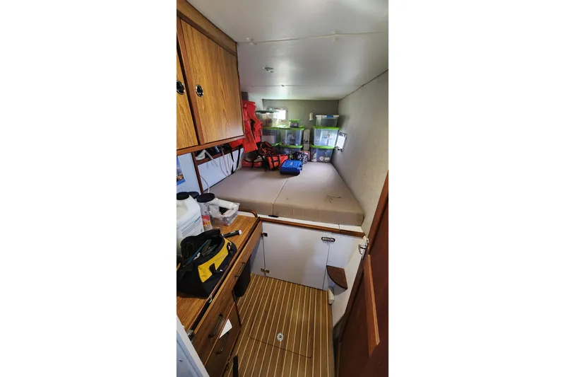 Slide: The Image of Interior of 2005 Endeavour 44 TrawlerCat with storage and wooden cabinetry. - 19