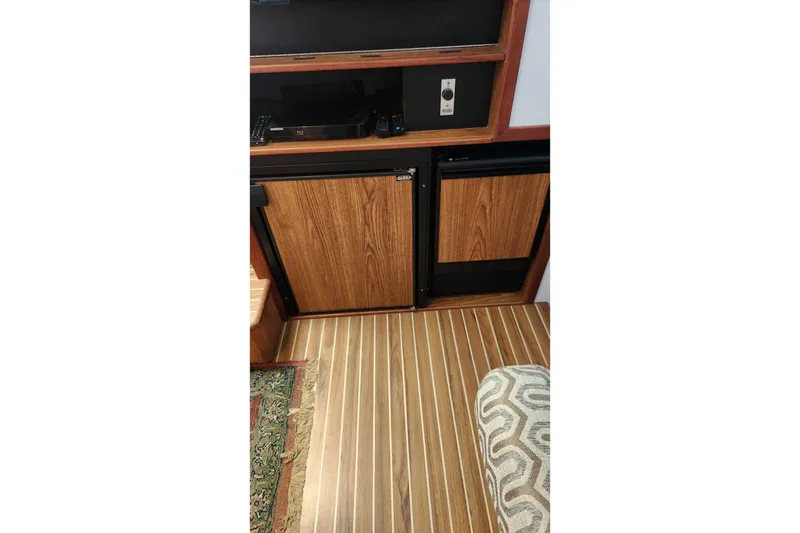 Slide: The Image of Interior of 2005 Endeavour 44 TrawlerCat with wood paneling and striped flooring. - 23
