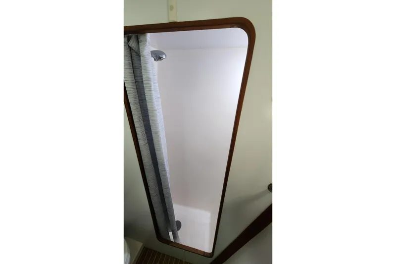 Slide: The Image of Interior view of 2005 Endeavour 44 TrawlerCat shower area with curtain and wooden trim. - 27