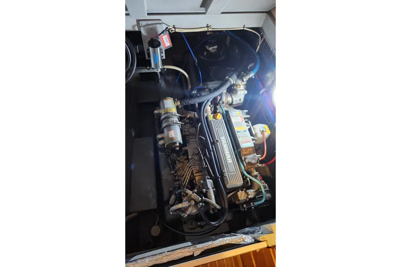 Slide: The Image of Engine compartment of a 2005 Endeavour 44 TrawlerCat, showcasing mechanical components. - 30