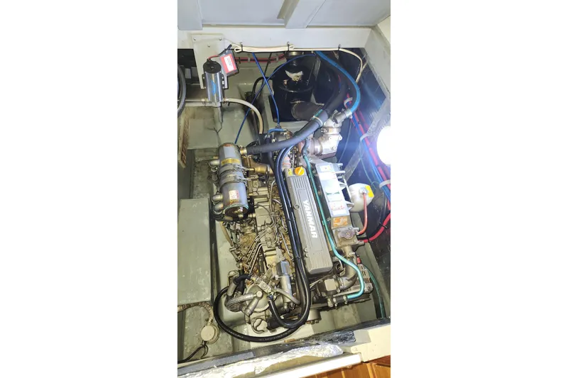 Slide: The Image of Engine compartment of a 2005 Endeavour 44 TrawlerCat, featuring a Yanmar engine. - 31