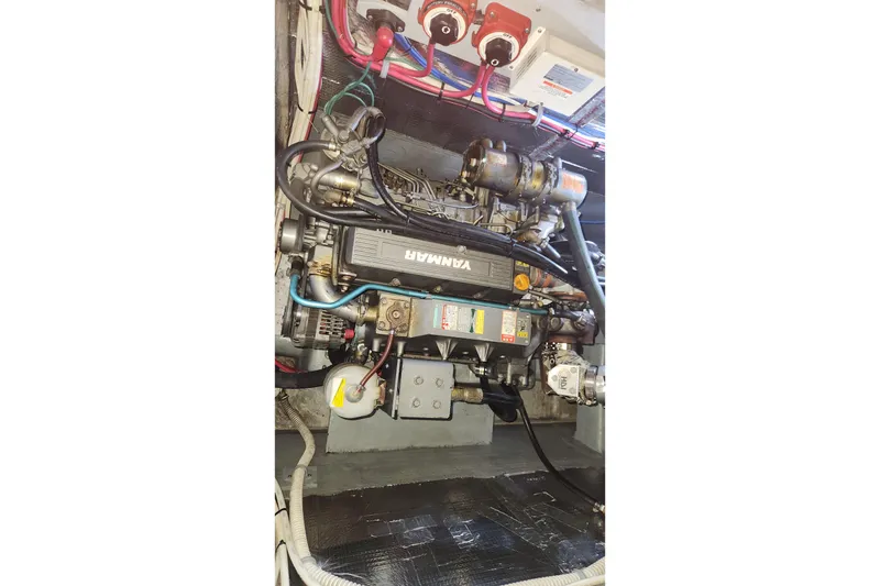 Slide: The Image of Engine compartment of a 2005 Endeavour 44 TrawlerCat with Yanmar engine components. - 33