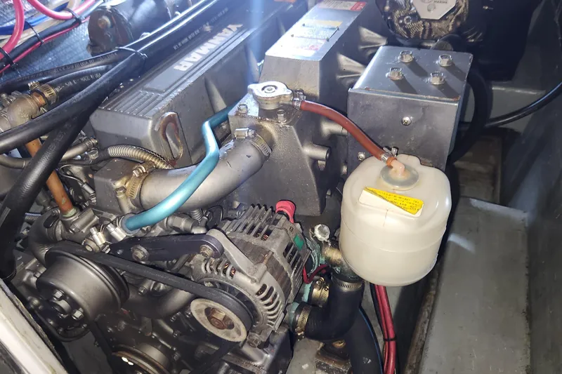 Slide: The Image of Engine compartment of a 2005 Endeavour 44 TrawlerCat, featuring a Yanmar engine. - 34