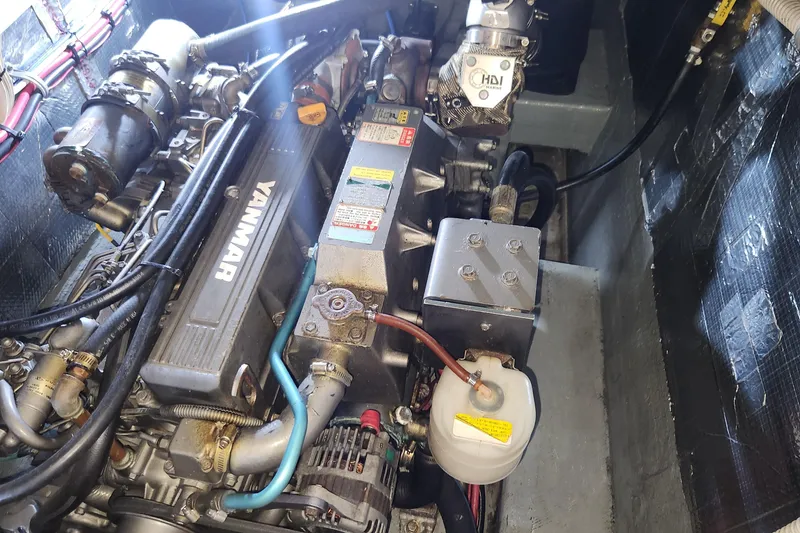 Slide: The Image of Engine compartment of a 2005 Endeavour 44 TrawlerCat, featuring a Yanmar engine. - 35