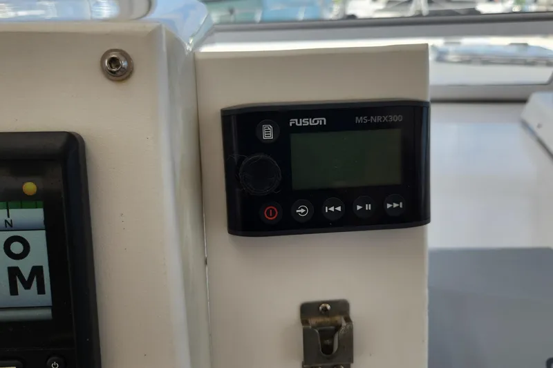 Slide: The Image of Fusion MS-NRX300 marine stereo on 2005 Endeavour 44 TrawlerCat dashboard. - 38