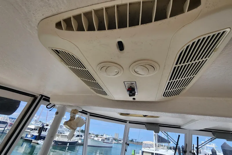 Slide: The Image of Ceiling air vent inside 2005 Endeavour 44 TrawlerCat, with marina view in background. - 45