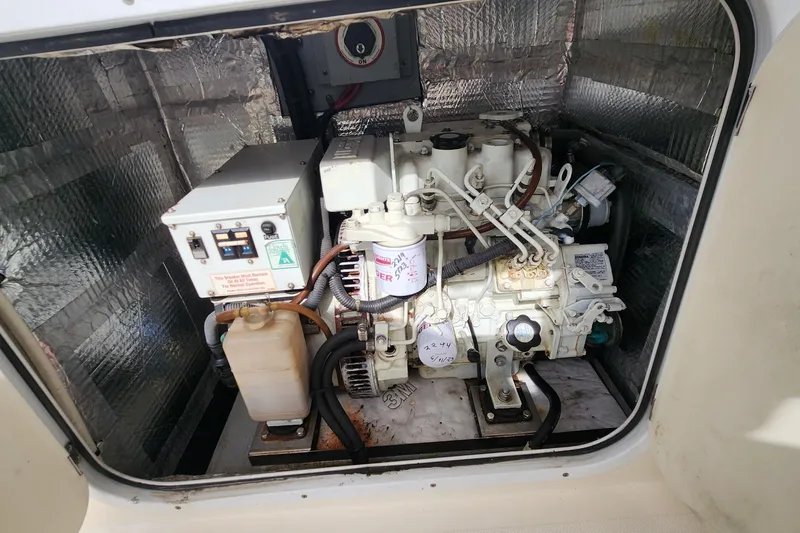 Slide: The Image of Engine compartment of a 2005 Endeavour 44 TrawlerCat, showcasing mechanical components. - 50