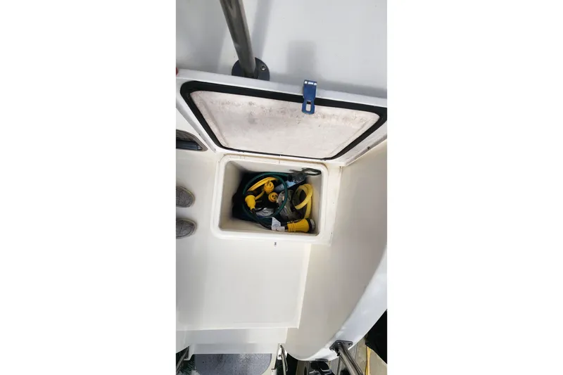 Slide: The Image of Storage compartment on 2005 Endeavour 44 TrawlerCat with cables and equipment. - 51