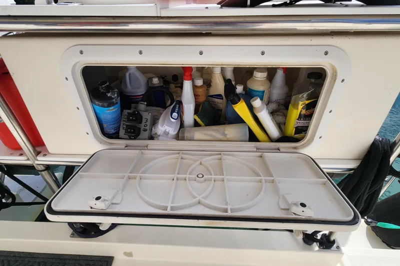 Slide: The Image of Storage compartment on 2005 Endeavour 44 TrawlerCat filled with cleaning supplies and tools. - 56