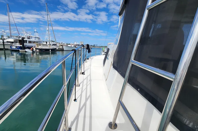 Slide: The Image of 2005 Endeavour 44 TrawlerCat docked at marina under blue sky. - 59