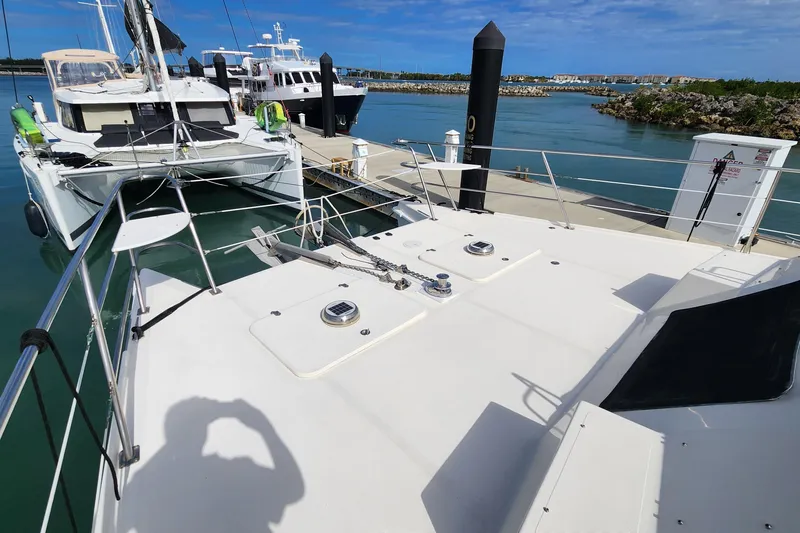 Slide: The Image of 2005 Endeavour 44 TrawlerCat docked at marina, clear sky, calm waters. - 60