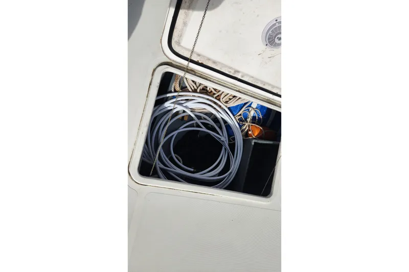Slide: The Image of Storage compartment on 2005 Endeavour 44 TrawlerCat with coiled ropes and equipment. - 64