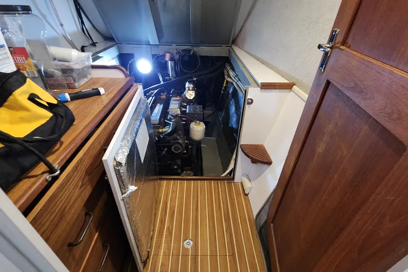 Slide: The Image of Engine room of 2005 Endeavour 44 TrawlerCat with wooden flooring and open access panel. - 78