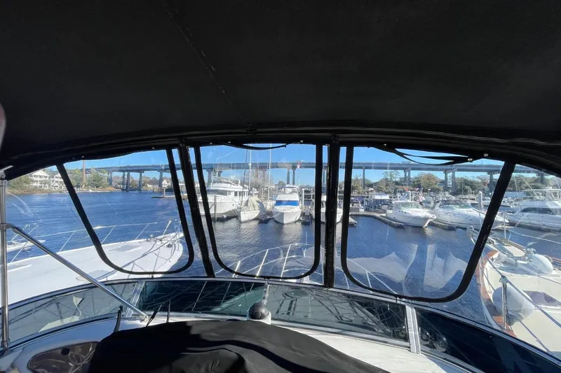 Slide: The Image of 2004 Meridian 459 Motoryacht docked in a marina, view from the helm. - 16
