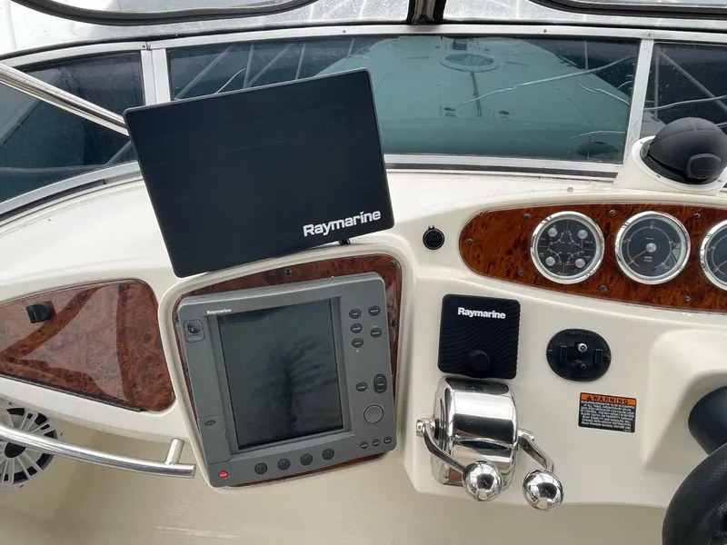 Slide: The Image of Control panel of 2004 Meridian 459 Motoryacht with Raymarine navigation equipment. - 22