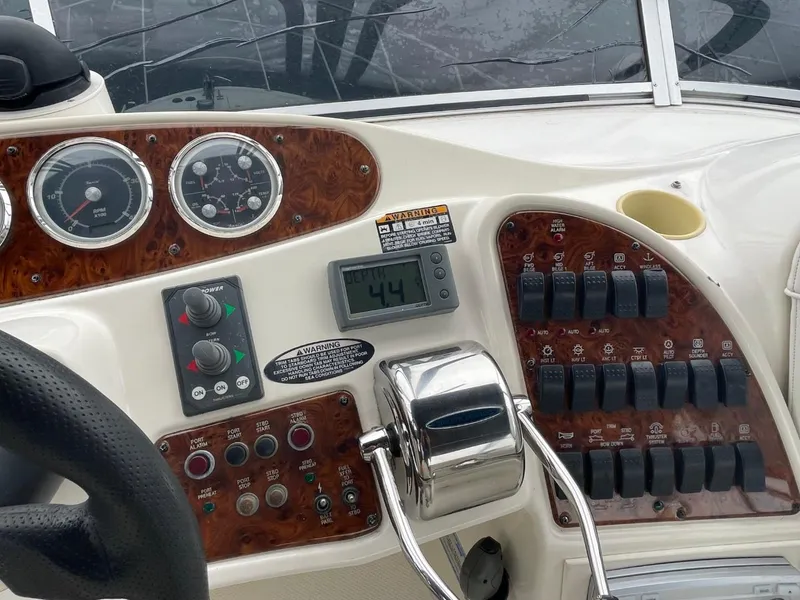 Slide: The Image of Control panel of a 2004 Meridian 459 Motoryacht with gauges and switches. - 23