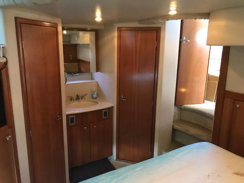 Slide: The Image of 2004 Meridian 459 Motoryacht interior with wood cabinetry and cozy sleeping area. - 39