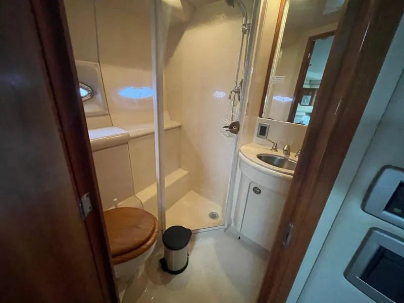 Slide: The Image of Bathroom interior of 2004 Meridian 459 Motoryacht with shower, sink, and toilet. - 44