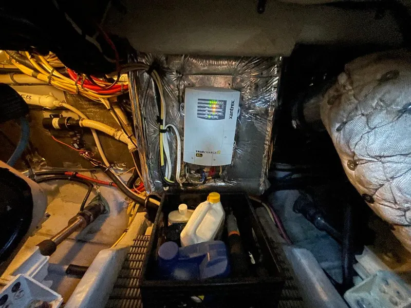 Slide: The Image of Engine room of 2004 Meridian 459 Motoryacht with electrical panel and maintenance supplies. - 52