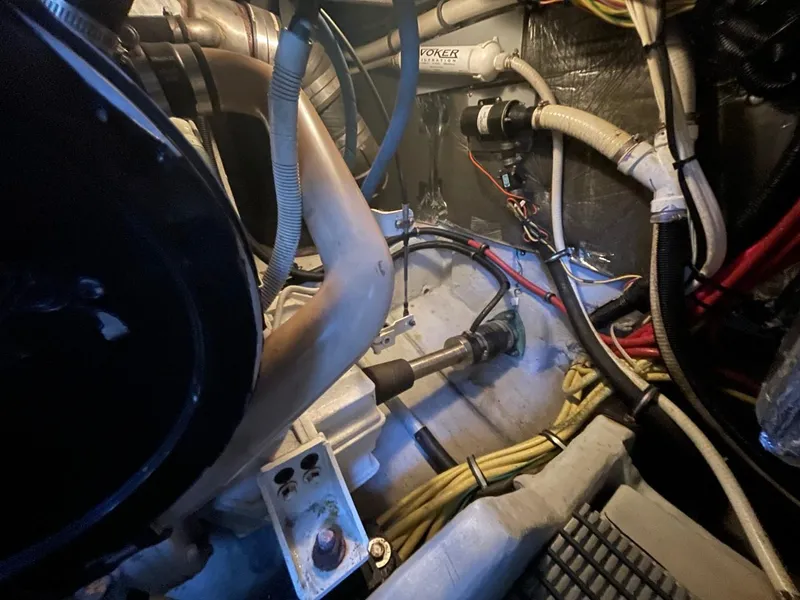 Slide: The Image of Engine room of 2004 Meridian 459 Motoryacht, showcasing mechanical components and wiring. - 53