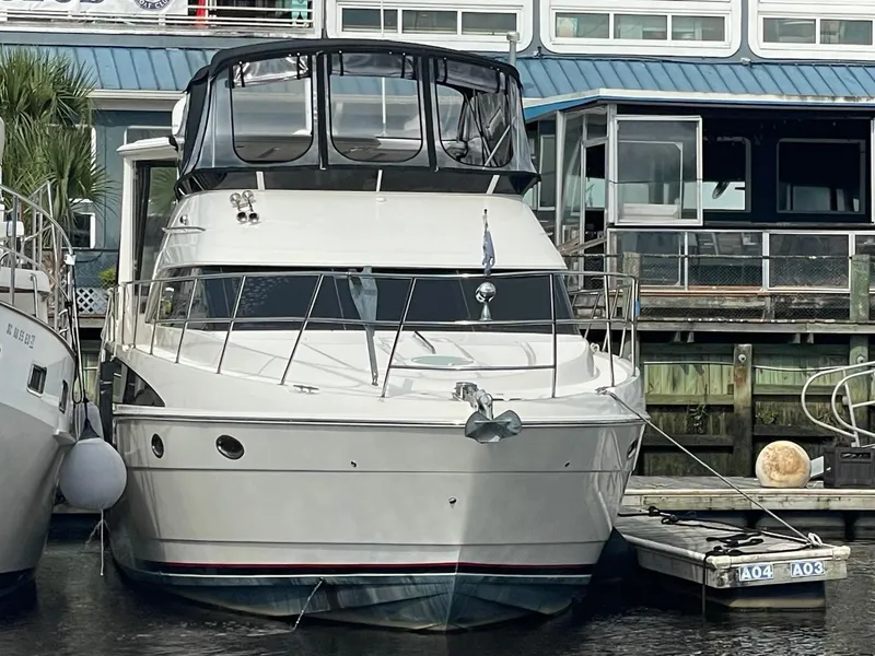 Slide: The Image of 2004 Meridian 459 Motoryacht docked at marina, front view. - 9