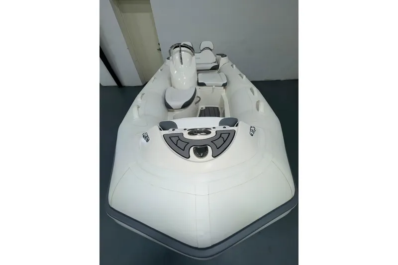 Slide: The Image of 2026 Zodiac Yachtline 400 inflatable boat, sleek white design, modern seating arrangement. - 11
