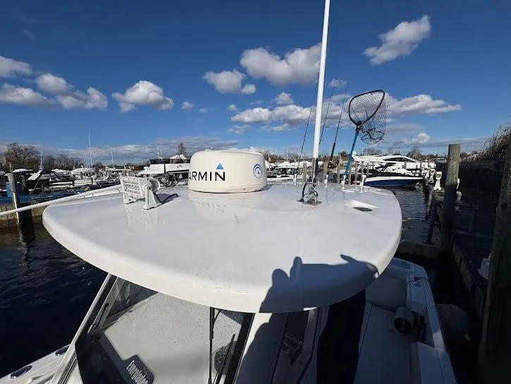 Slide: The Image of 2016 Everglades 295 Center Console boat docked with Garmin equipment. - 11