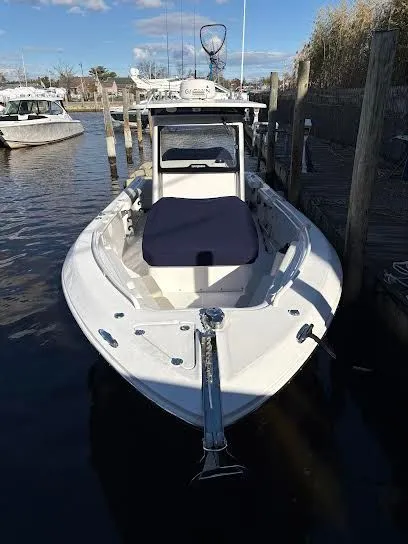 Slide: The Image of 2016 Everglades 295 Center Console boat docked in harbor. - 13