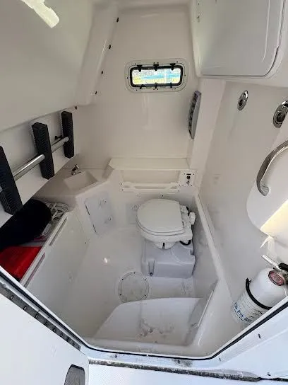 Slide: The Image of Interior of 2016 Everglades 295 Center Console with toilet. - 3