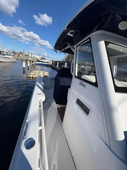 Slide: The Image of Everglades 295 Center Console 2016 at dock, sunny day. - 9