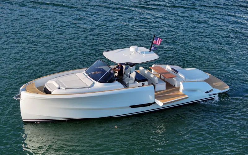 Slide: The Image of 2022 Solaris Power yacht on water, featuring open design and fractional ownership option. - 1