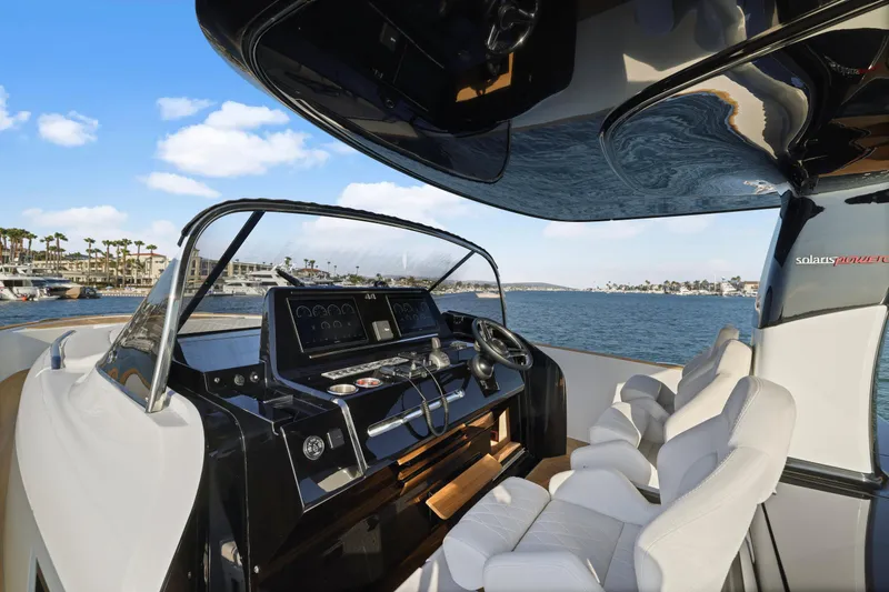 Slide: The Image of Luxurious 2022 Solaris Power yacht interior with modern helm, offering fractional ownership. - 11