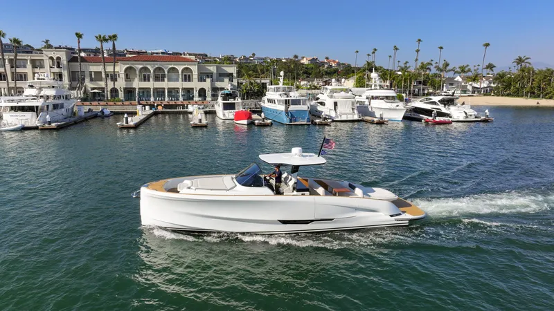 Slide: The Image of 2022 Solaris Power yacht cruising near marina, showcasing fractional ownership model. - 2