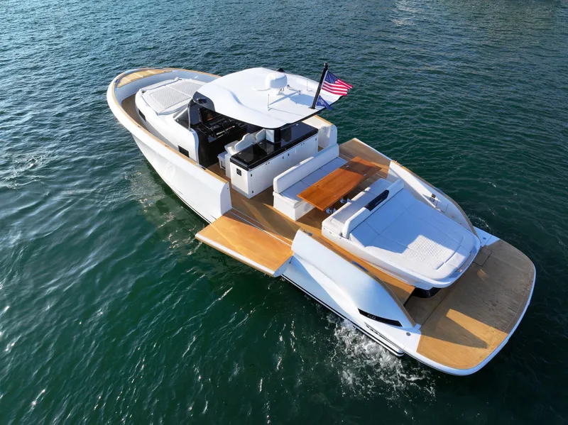 Slide: The Image of 2022 Solaris Power yacht on water, featuring open deck and fractional ownership. - 4