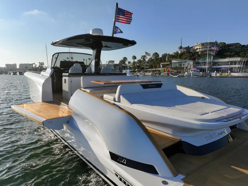Slide: The Image of 2022 Solaris Power yacht, Open model, fractional ownership, docked in a sunny marina. - 5