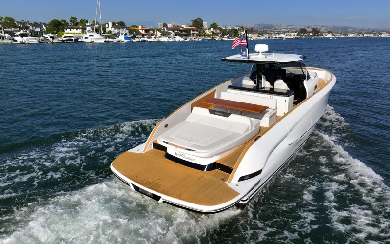 Slide: The Image of 2022 Solaris Power yacht on water, showcasing open deck and fractional ownership. - 9