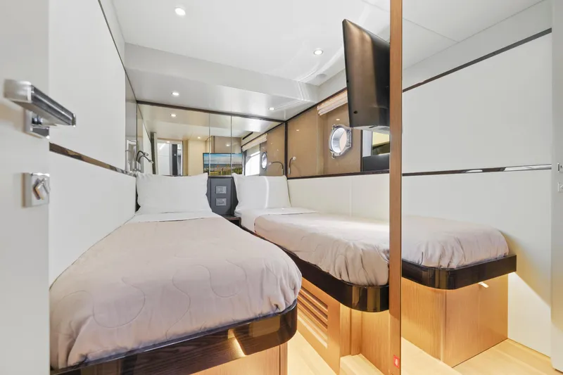 Slide: The Image of Luxurious twin cabin in 2024 Absolute 60 Fly Co Ownership yacht, featuring modern design and amenities. - 48