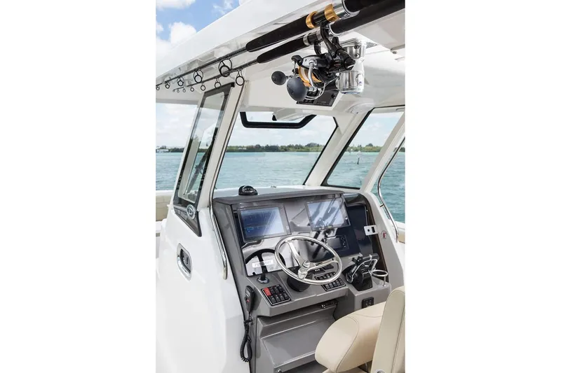 Slide: The Image of Manufacturer Provided Image: 2021 Pursuit S 328 Sport boat helm with advanced navigation systems. - 11