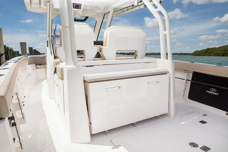 Slide: The Image of Manufacturer Provided Image: 2021 Pursuit S 328 Sport boat interior with seating and storage. - 14